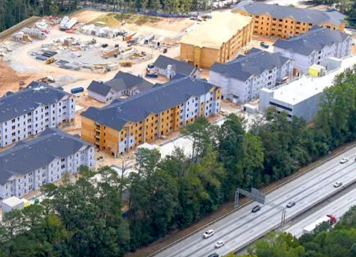 Near airport, project delivers 450 homes a year ahead of schedule